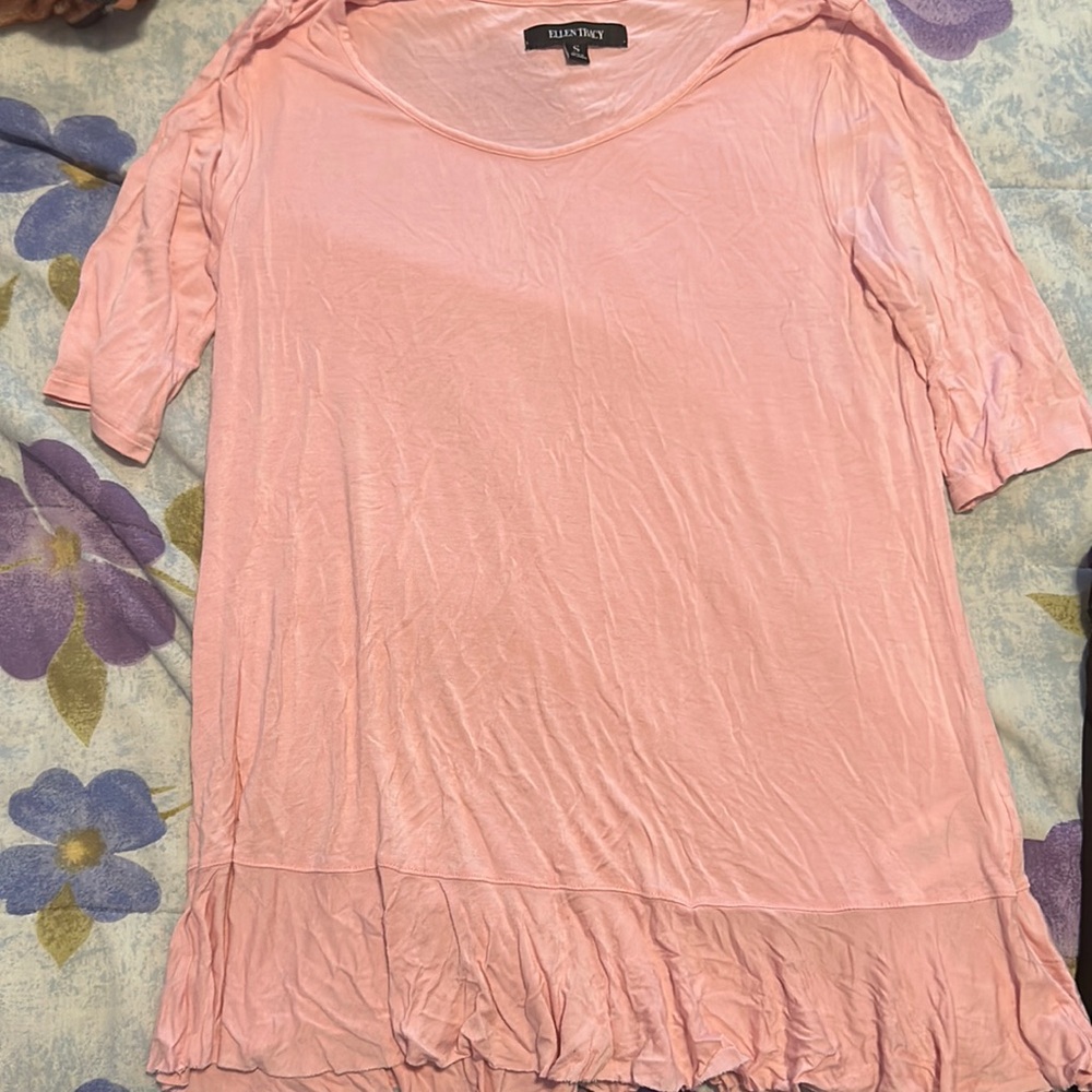 Light pink half sleeve shirt with frill on the bottom. Worn once